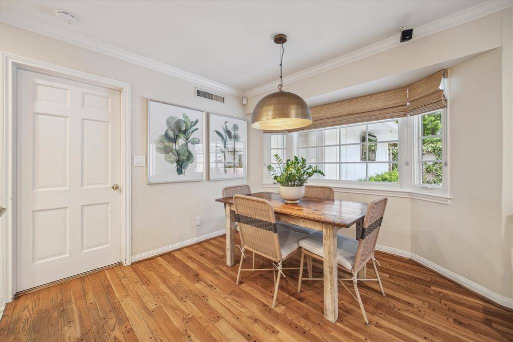 The breakfast room is located off the kitchen with views of the backyard. The door shown leads to the walk in laundry room.