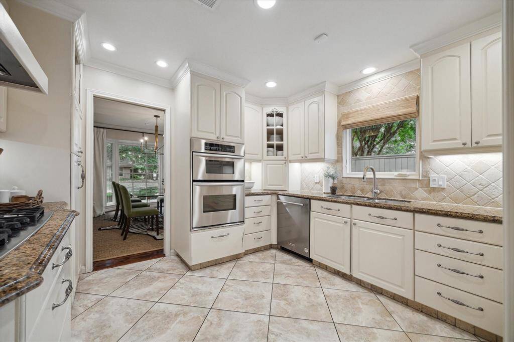 The kitchen window overlooks the putting green located in the side yard.