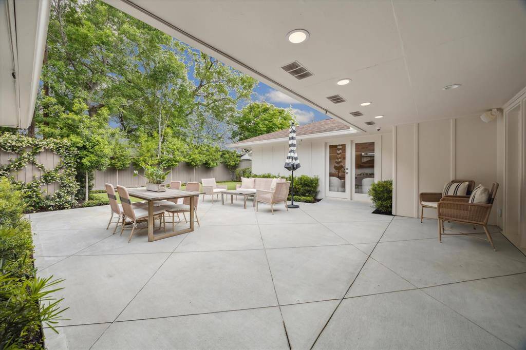 The backyard was fully updated in 2023 with new concrete patio, turf in the backyard, a putting green in the sideyard (not pictured), and new landscape throughout!