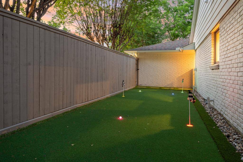 The putting green was installed in 2023 and is located off the kitchen.