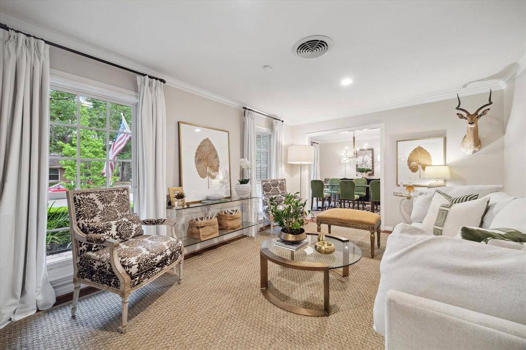 Step into the formal living room, a spacious room with fabulous natural light from the two windows facing the front yard.