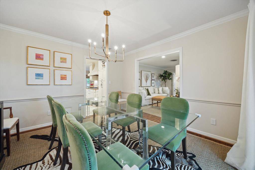 Alternate view of the dining room that shows the doorway to the kitchen off the dining room.