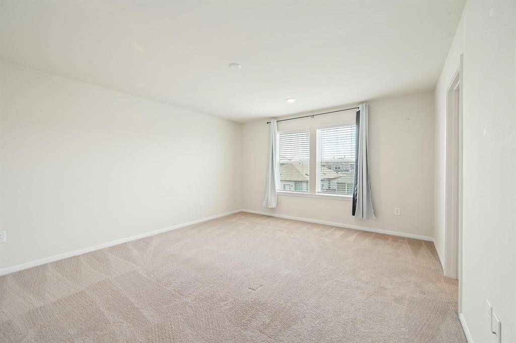 Upstairs, a spacious game room, perfect for family fun, hobbies, or relaxing with friends.