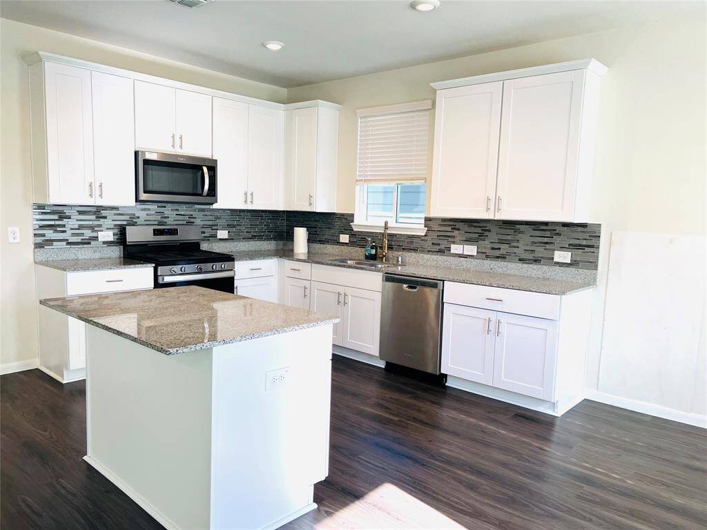 Beautiful Granite kitchen with white cabinets