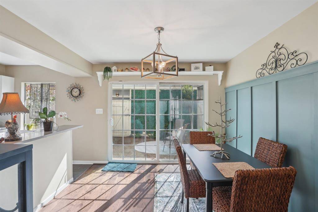 Dining area seamlessly leading into the kitchen and back patio.