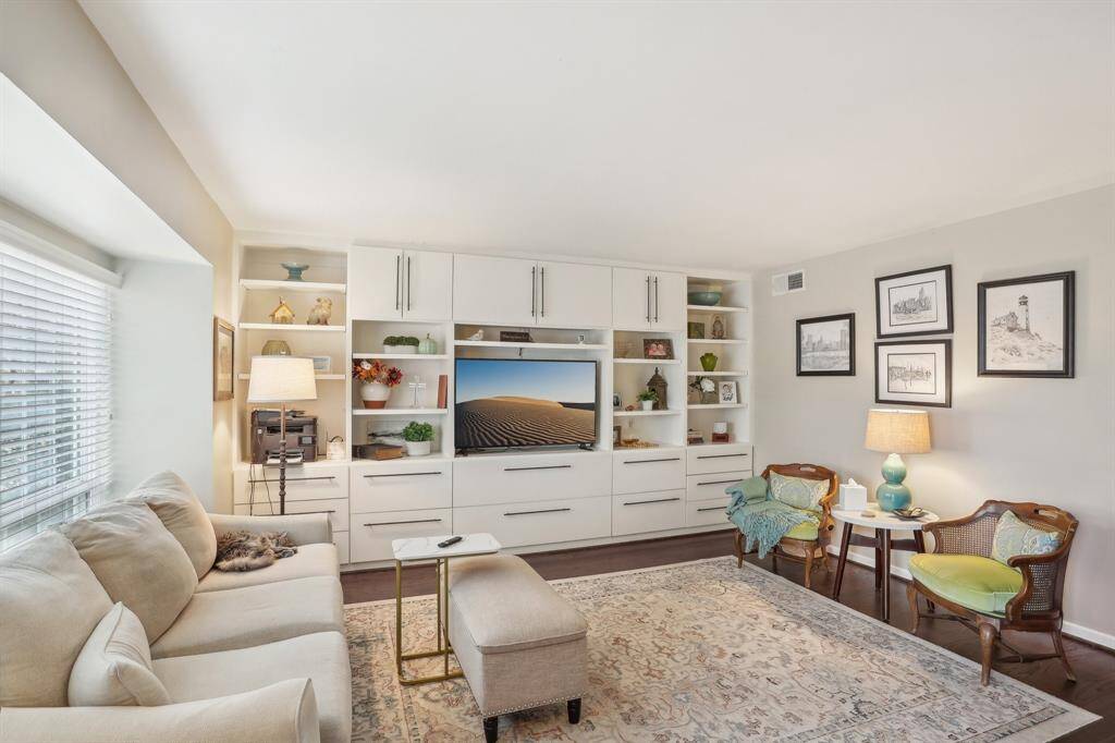 Spacious living room with built in shelving.