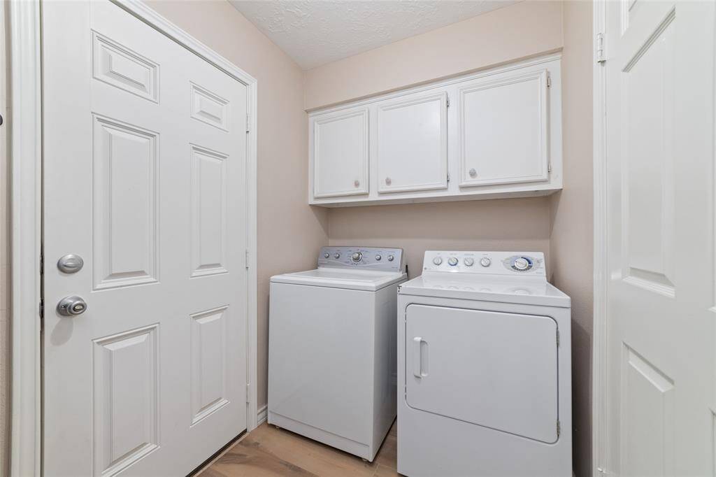 Laundry room inside the home off the kitchen