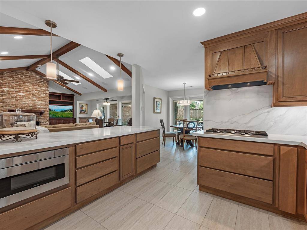 Enjoy the seamless flow from the kitchen to the inviting family room and cozy breakfast area.