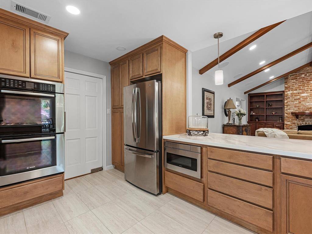 This modern kitchen features sleek stainless steel appliances.