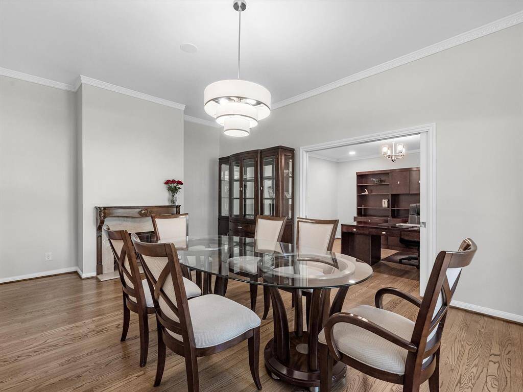 Elegant dining room with seamless access to an adjacent office, perfect for work and entertaining.