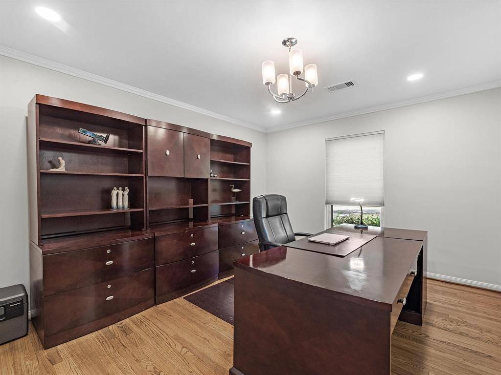 Conveniently located next to the formal dining room, this office offers both accessibility and privacy.