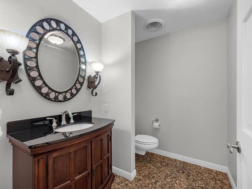 Stylish half bath perfect for guests.