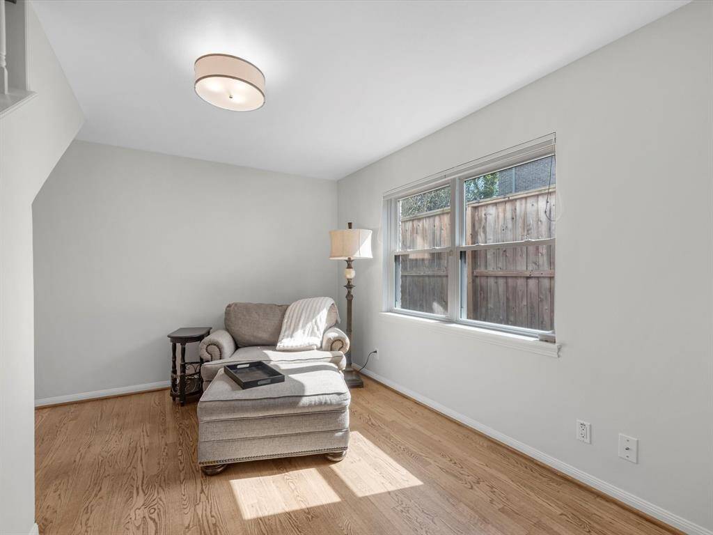 Inviting bedroom, currently transformed into a cozy reading nook.