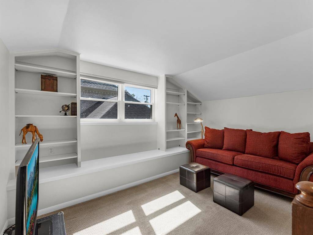 Enjoy a cozy entertainment nook upstairs, perfect for relaxing with your favorite shows.