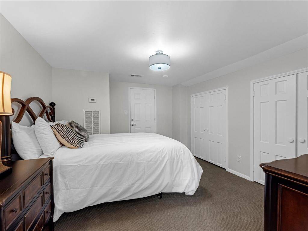 Upstairs bonus room currently serves as a cozy bedroom.