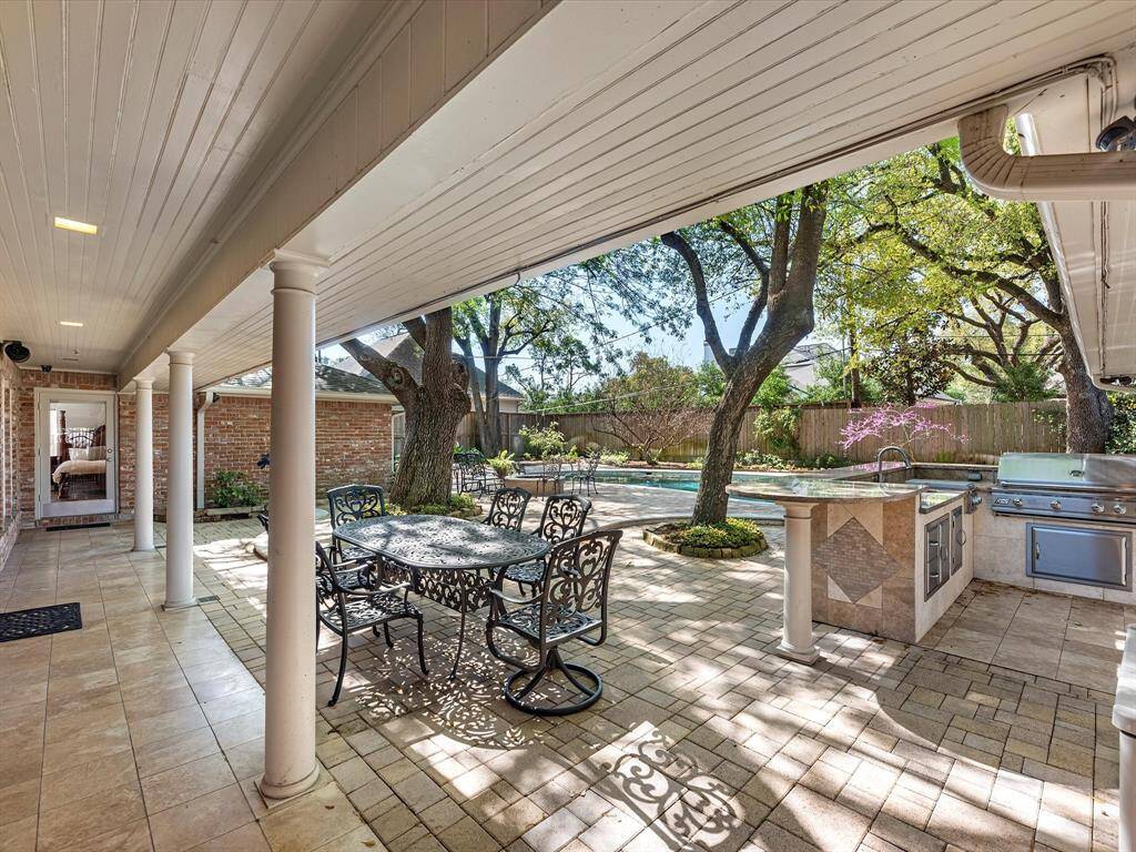 Enjoy your morning coffee or evening wine in this inviting shaded retreat.