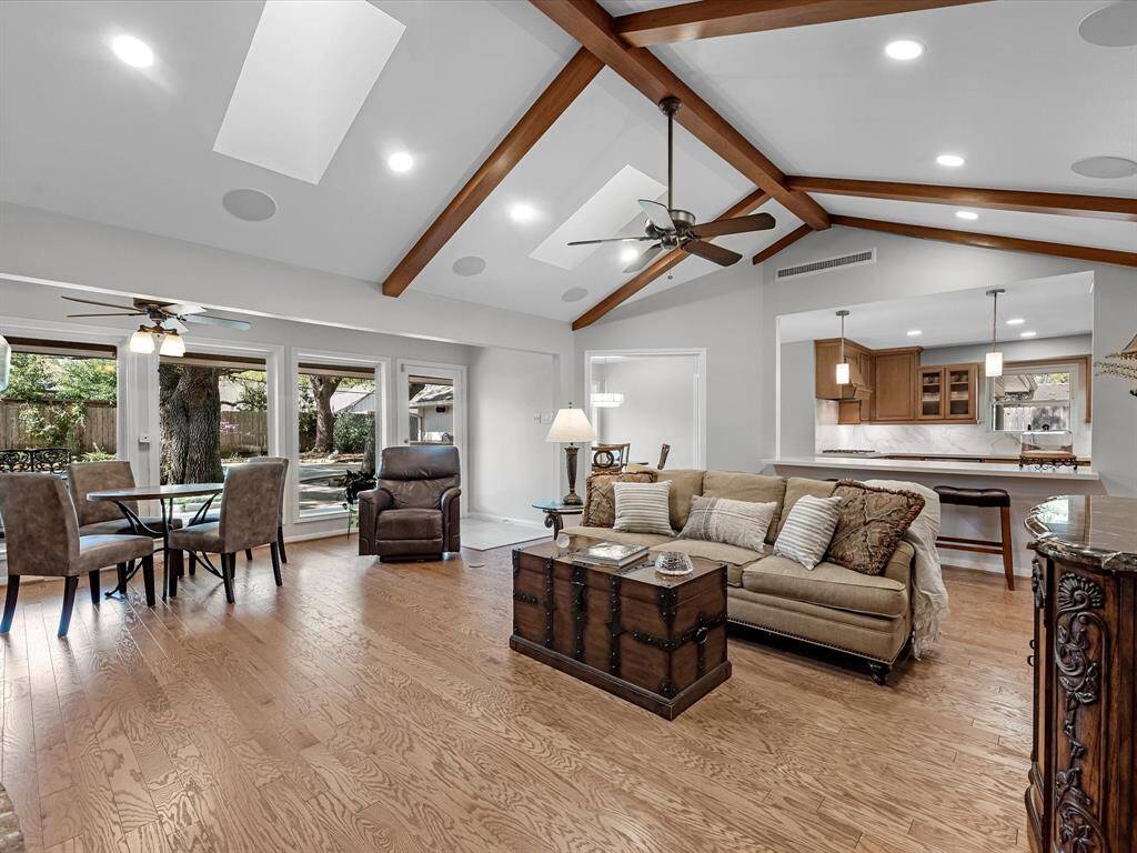 This inviting family room features stunning vaulted ceilings, offering an open and airy ambiance.