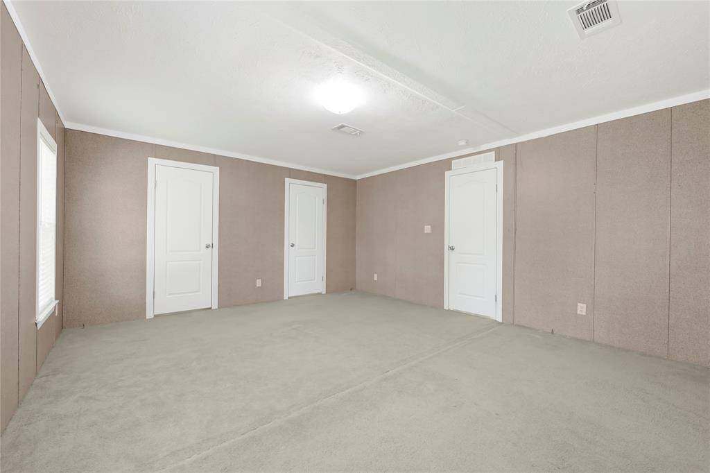 Another view of primary bedroom
