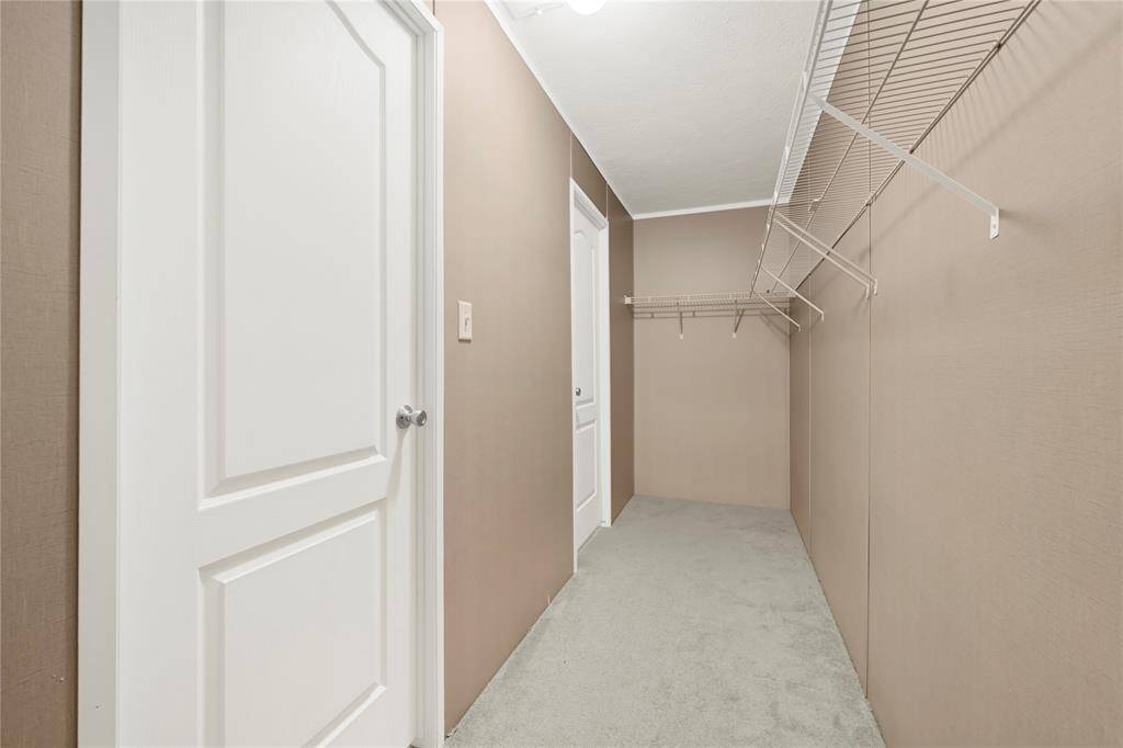 Large walk-in closet with two doors