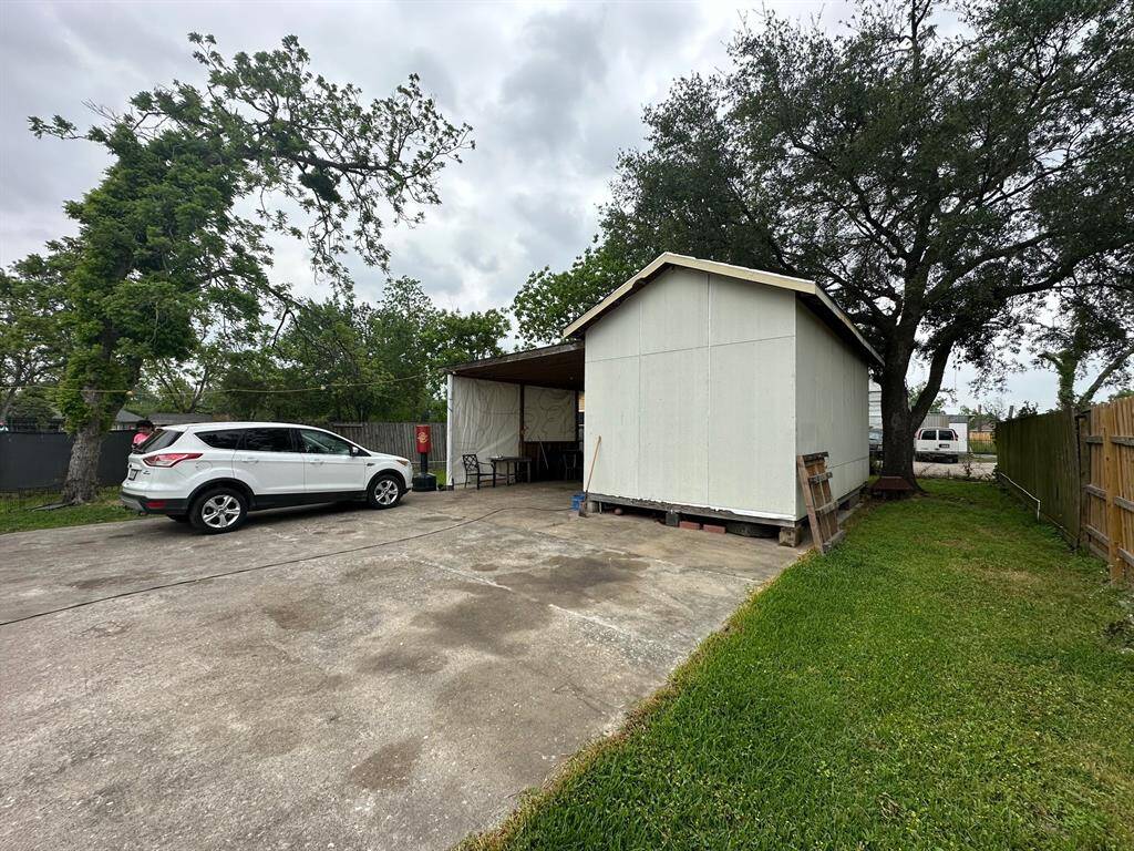 Another view of carport and workshop