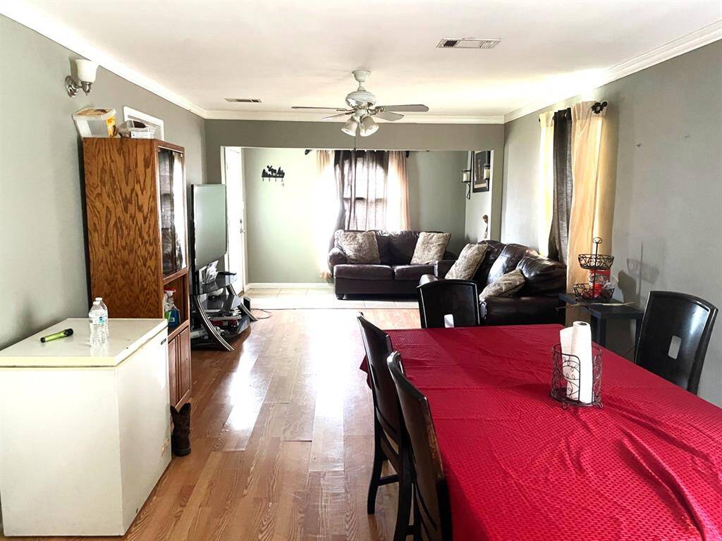 Living/dining room combination with crown molding