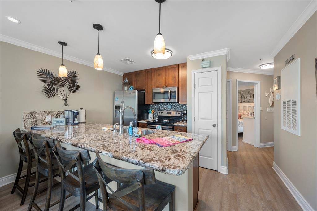 Kitchen with granite and stainless appliances