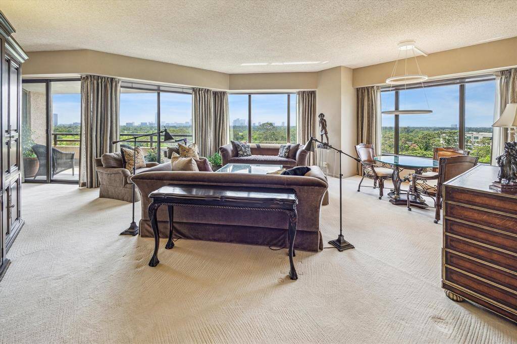 LIVING ROOM with adjoining balcony.
