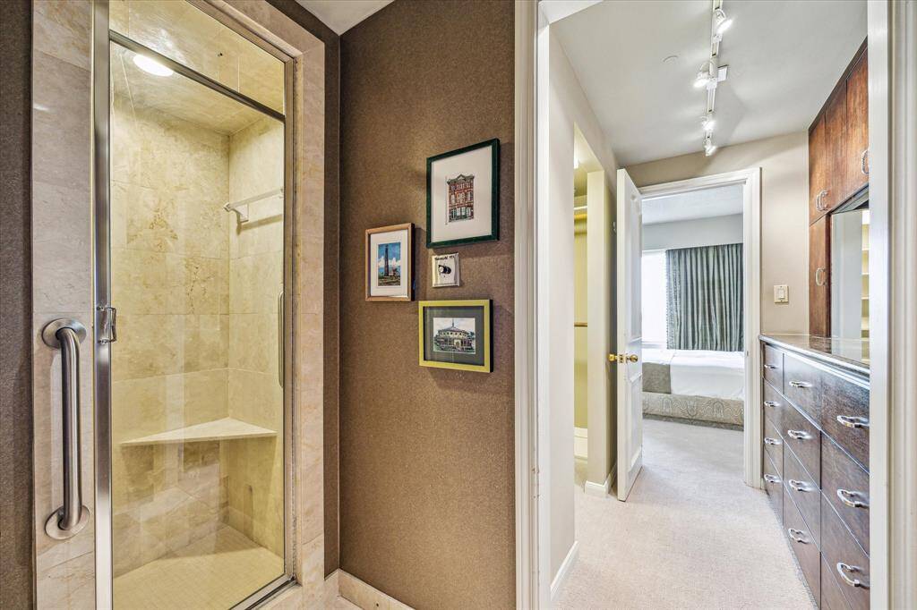 One of two Primary baths with marble counter tops & flooring. Elegant fixtures, bidet, & soaking tub!