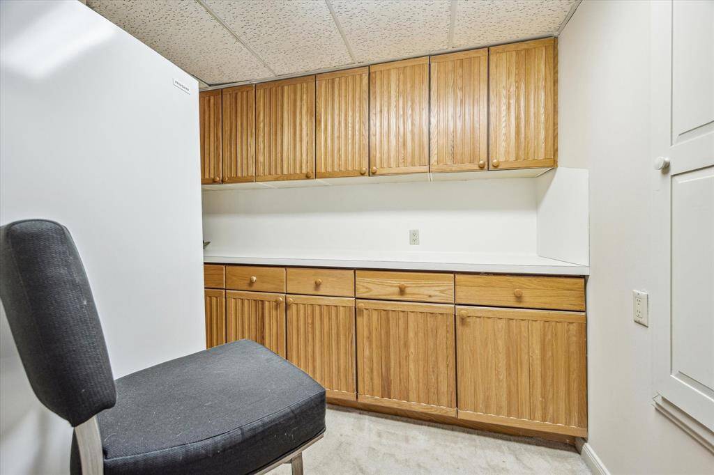 STORAGE ROOM: 12 X 8 with built-in cabinets & ironing board.