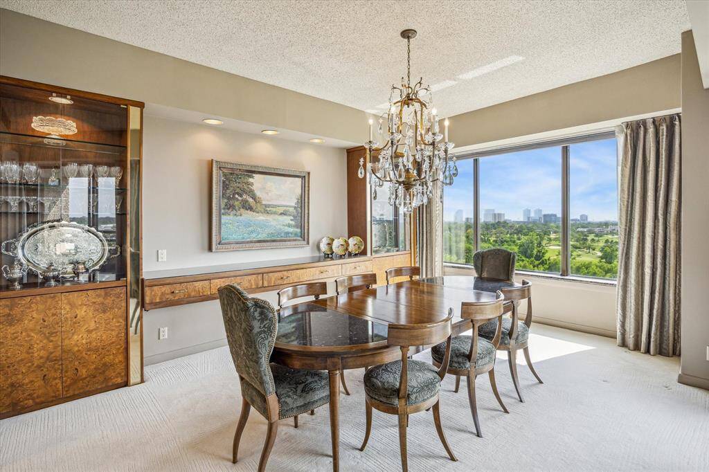 DINING ROOM: 17 X 13Built-in burl wood cabinets with glass fronts. Exquisite views from dining room and balcony.