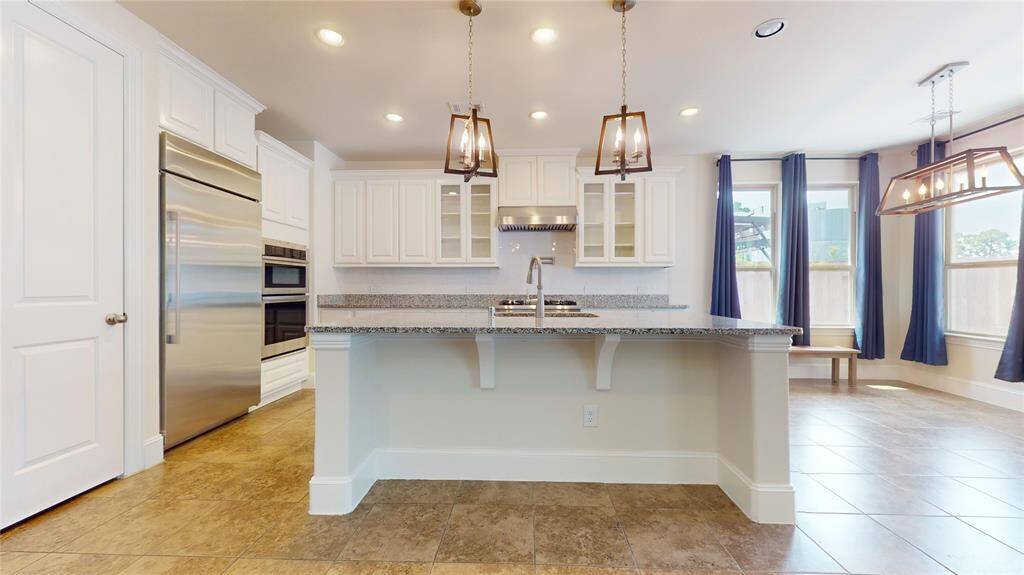 The ample kitchen with a subzero refrigerator