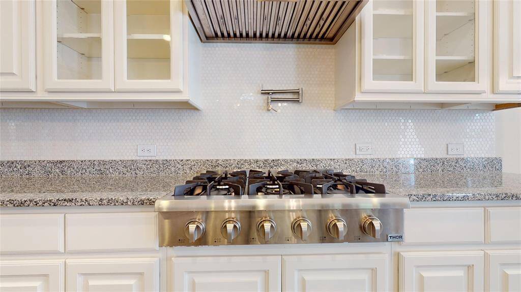 Professional gas range top with six burners and pot filler