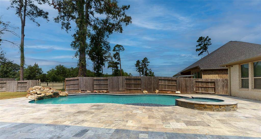 Relax in the hot tub surrounded by beautiful mature trees