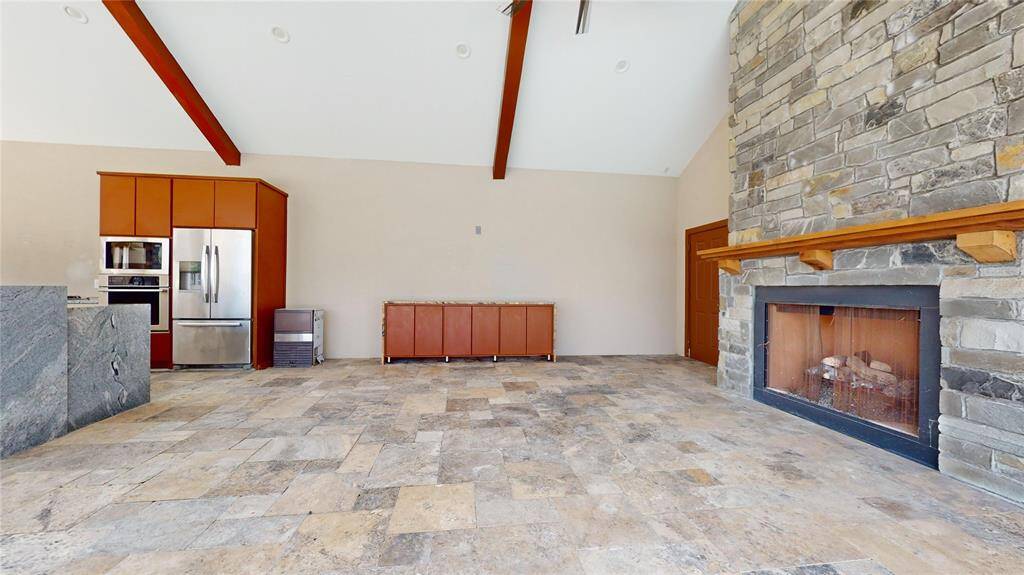 Gather around the outdoor fire place with friends and family