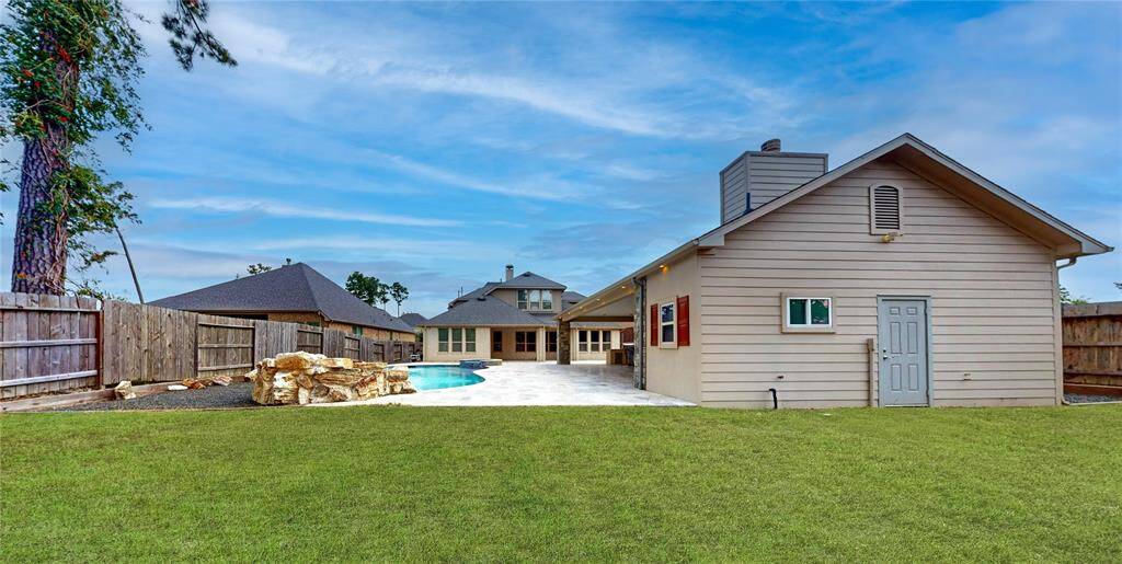 And yes! there is still green space and even more storage behind the outdoor living area, conveniently located to store your gardening tools