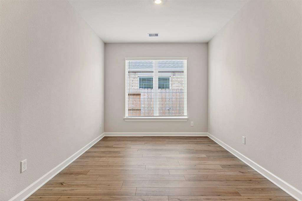 Located just adjacent to the living room, the dining room has lots of natural light and can accommodate even the largest of tables.