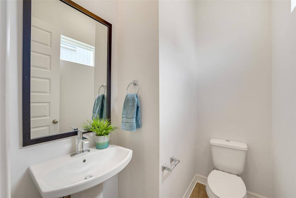 Conveniently located on the second floor, this stylish half bathroom offers modern finishes & easy access for both residents or guests.