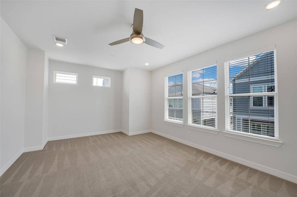 The spacious 3rd floor primary suite with its natural light, creates a bright & inviting atmosphere. Plush carpeting adds warmth & comfort, making it the perfect retreat at the end of the day.