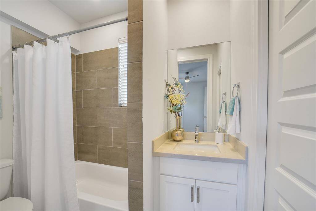 The 1st floor bedroom comes complete with its own full-size bathroom, offering comfort & privacy for guests or household members.