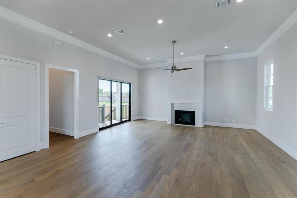 The gas log fireplace adds charm and comfort to the living room.