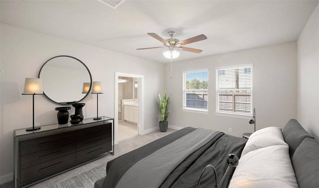 Relaxing primary suite on first floor (*Photo not of actual home and used for illustration purposes only.)