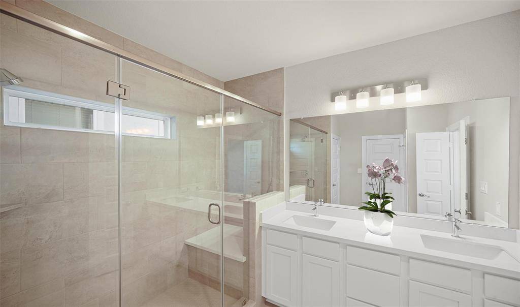 Serene primary bath with dual sinks and large shower (*Photo not of actual home and used for illustration purposes only.)