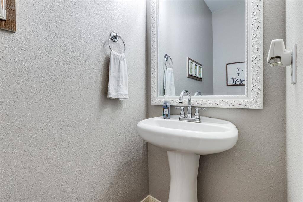 Guest power room or half bath in the hallway to living room.