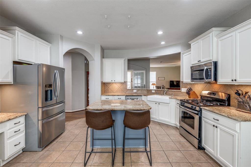 Stainless steel appliances and gas oven range.