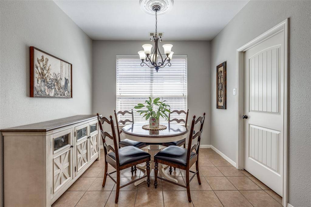 Breakfast nook is perfect for a circular table. Laundry room to the right.
