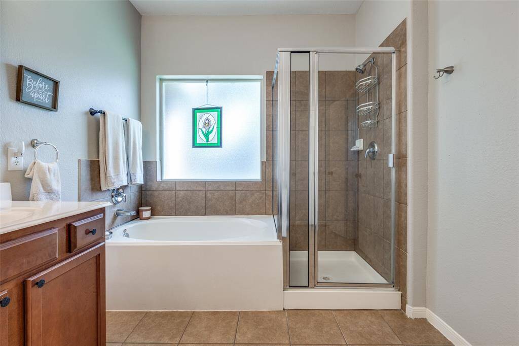 Separate walk in shower next to the soaker tub.