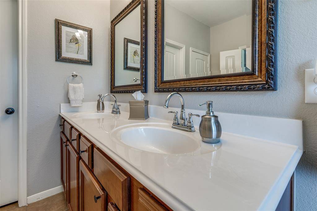 Double vanities with plenty of counter space. Custom mirrors for decor.