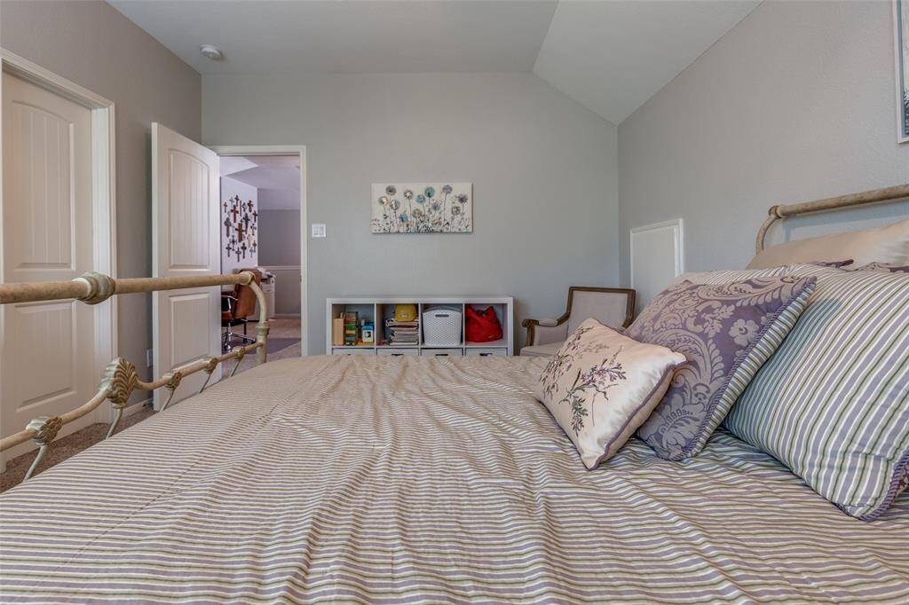 Secondary bedroom next to the hallway bathroom. Large walk in closet through door.
