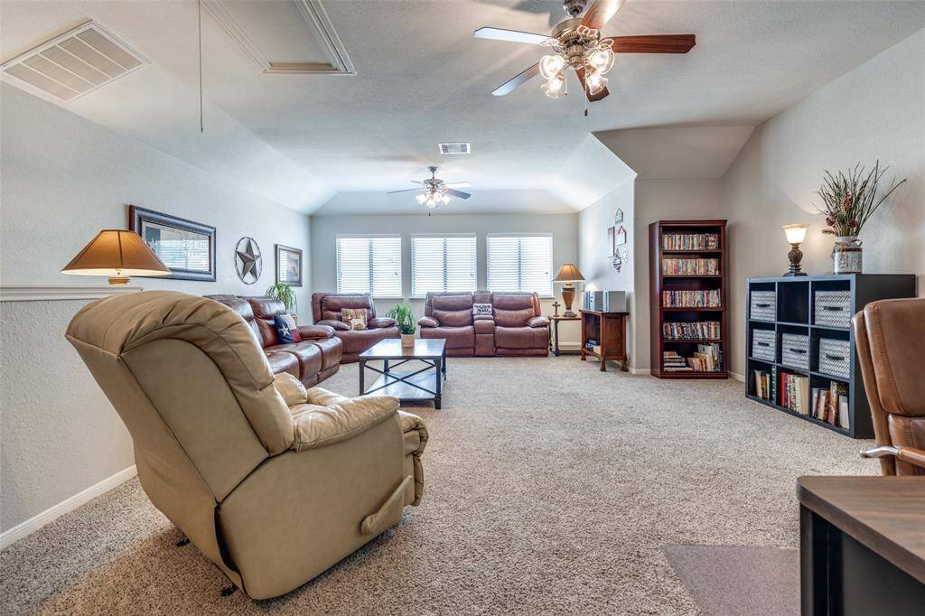 View of Family Room upstairs. Seller currently uses as home office as well.