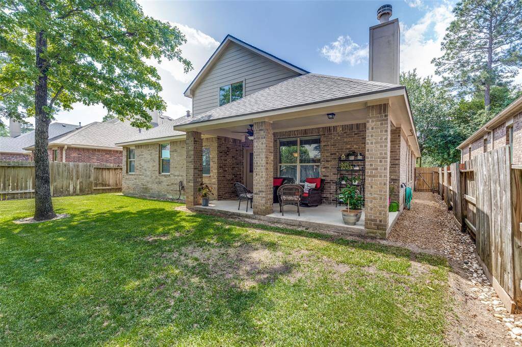 View of spacious back yard and patio.